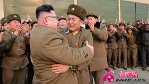 Picture of Kim Jong-un embracing a military officer in a photo released on 19 March 2017